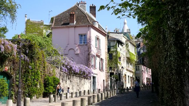 Sacre Coeur tourists and beautiful street of Montmartre Paris