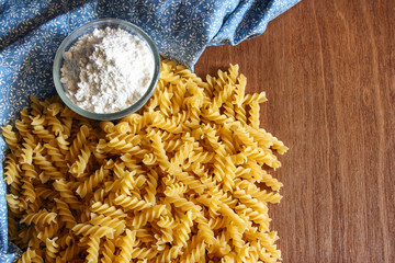 Uncooked fusilli pasta background