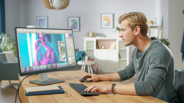 Professional Photographer Works in Photo Editing App / Software on His Personal Computer. Photo Editor Retouching Photos of Beautiful Girl. Mock-up Software Design.