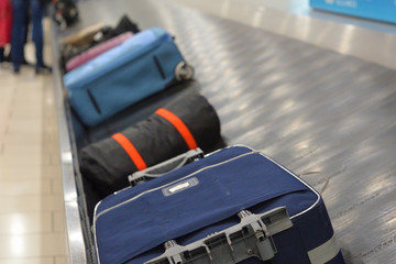 The movement of baggage on a conveyor belt
