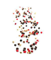 Mix of different pepper grains on white background, top view