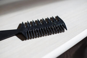 comb with torn hair lying on the table