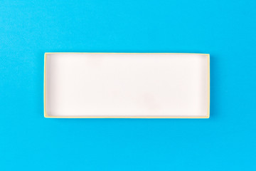 Empty box for product on blue background. top view