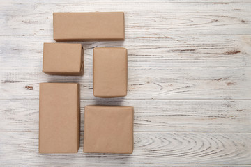 cardboard box on white wooden background, Brown mail package top view