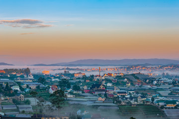 Fototapeta na wymiar Sun Rise on Da Lat City, The Place cover Fog almost every morning early