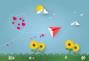  Love and valentines day. Red paper airplane or rocket flying look like heart shape on sky and hearts