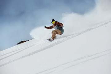 Snowboarder offpiste slope downhill fast