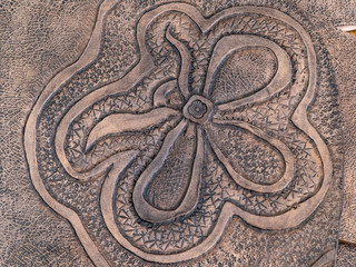colored floral pattern on carved leather