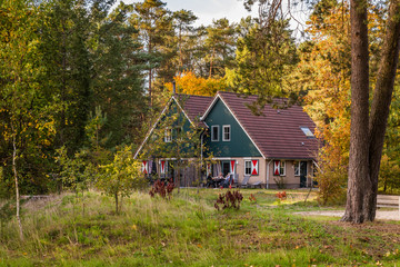 Cozy little holiday home with colorful classic wooden shuttered windows