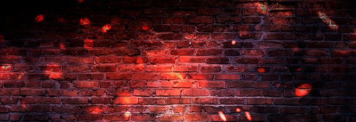 Dark basement room, sparks of fire and light on the walls. Neon lamps on the wall, night view. Empty brick wall.