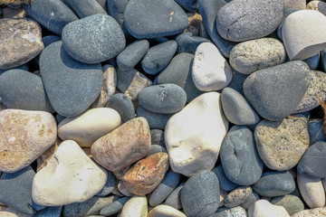 Background shot of smooth pebbles found on the beach.