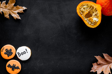 Halloween composition with autumn harvest and cute round hallooween badges with rats, ghousts, Boo text on black background top view copy space