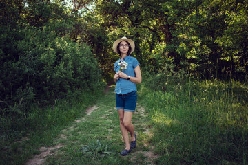 pregnant mom expecting in the summer field