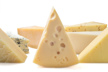 Different kinds of cheeses isolated on white background.