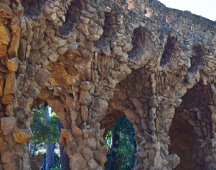 Beautiful stone walls, on top of which palm trees grow.
