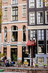 Naklejka premium Amsterdam Holland, the old city near the canals. Concept life in the city.
