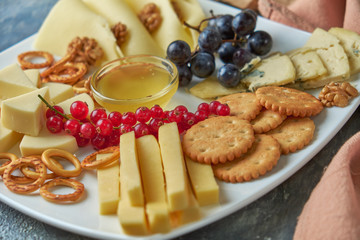 cheese platter on a plate with berries