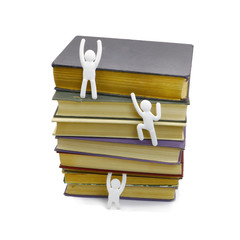 old book and white cardboard people