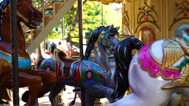 Fascinating close up view on vintage circus carousel retro merry go round horse ride kids attraction at amusement park