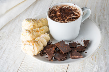 Morning breakfast, a cup of coffee and croissants