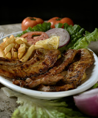 steak with potatoes in plate in restaurant