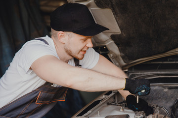 Fototapeta na wymiar Mechanic working in auto