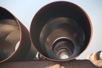 Big pipe waiting for construction of a wind turbine on production site at the Maasvlakte harbor in Rotterdam, the Netherlands