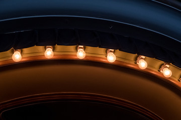 stage lights before curtain opening