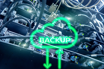 Backup button on modern server room background. Data loss prevention. System recovery.