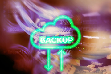 Backup button on modern server room background. Data loss prevention. System recovery.