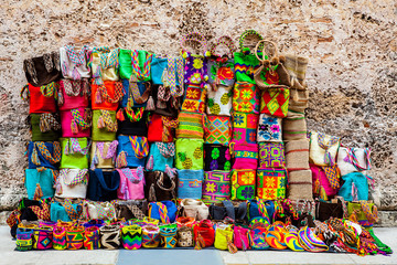 Street sell of handcrafted traditional Wayuu bags at the walled city of Cartagena de Indias - obrazy, fototapety, plakaty