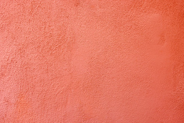 Old red whitewashed wall with rich and various texture.