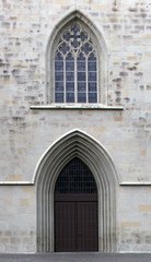 Fototapeta na wymiar Old door in the Gothic style. Vasad church. Catholic...