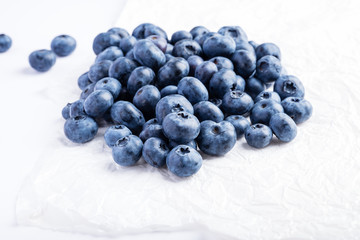 Fresh raw organic farm blueberry white background, copy space