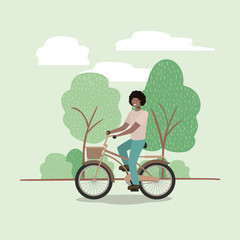 young man in bicycle on park