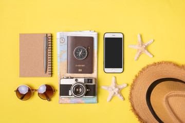 Traveler accessories on yellow background with camera and sunglasses. Top view travel or vacation concept. Flat lay, top view. Summer background.