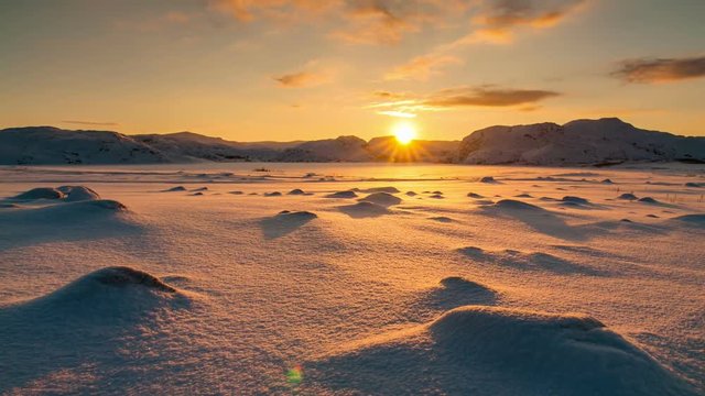 Snowy Arctic tundra at sunset. Timelapse