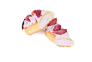 Delicious dessert on a white background. A fresh and tasty eclair is isolated on a white background, with beautiful decor.