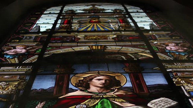 Stained Glass in church. Christianism, religion, holy father and Jesus