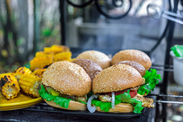 BBQ Burgers Breast With Vegetables On The Hot Charcoal Grill
