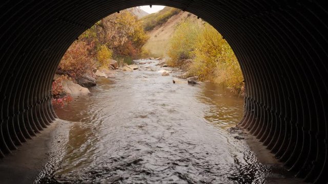 From inside looking out of an metal culvert