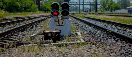 Traffic light shows red signal on railway. Red light. Railway tracks with red light semaphore © volody10
