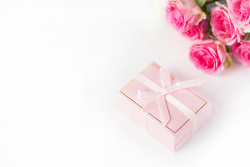  Pink gift wrap with bouquet of flowers on white background