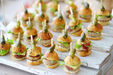 Delicious one bite mini burgers served on a party or wedding reception.