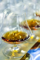 Alcohol brandy or whiskey in a glass. Soft focus, Macro.