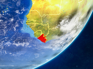 Fototapeta premium Liberia on model of planet Earth with country borders and very detailed planet surface and clouds.