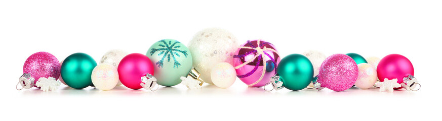 Christmas border of pastel colored decorations isolated on a white background