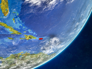 Puerto Rico on model of planet Earth with country borders and very detailed planet surface and clouds.