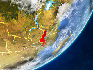 Malawi on model of planet Earth with country borders and very detailed planet surface and clouds.