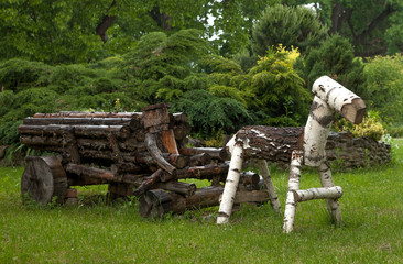 The cart with a horse made of wood adorn the park